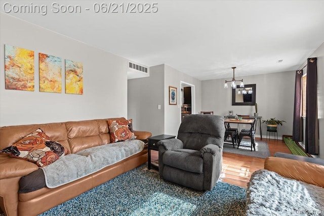 30546 Townley St, Madison Heights, MI 48071 - living room featuring a chandelier and wood finished floors