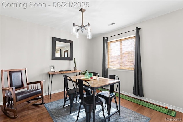 30546 Townley St, Madison Heights, MI 48071 - dining room with a chandelier and dark wood-style floors