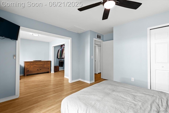 30546 Townley St, Madison Heights, MI 48071 - bedroom with wood finished floors, attic access, a walk in closet, a closet, and ceiling fan