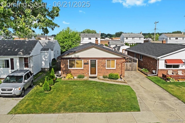 30546 Townley St, Madison Heights, MI 48071 - view of front of house featuring brick siding, concrete driveway, and a residential view