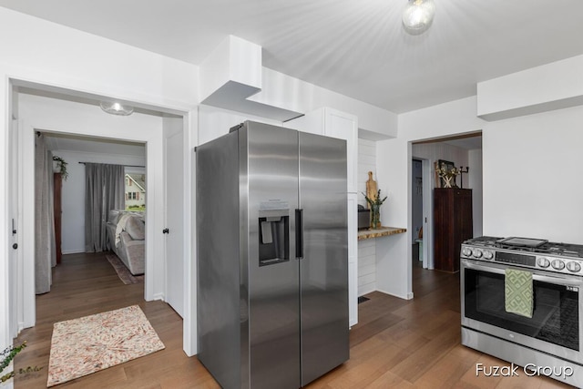 4733 136th Ave, Hamilton, MI 49419 - kitchen with appliances with stainless steel finishes, wood finished floors, and white cabinets