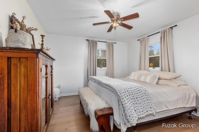 4733 136th Ave, Hamilton, MI 49419 - bedroom featuring multiple windows, wood finished floors, and a ceiling fan