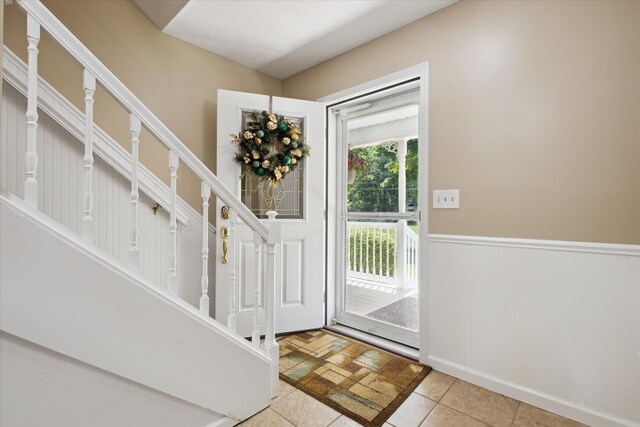 30170 Beeson St, Dowagiac, MI 49047 - entrance foyer with stairway and light tile patterned floors