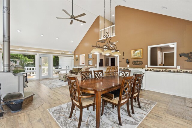 30170 Beeson St, Dowagiac, MI 49047 - dining area with high vaulted ceiling, a ceiling fan, wainscoting, and hardwood / wood-style flooring