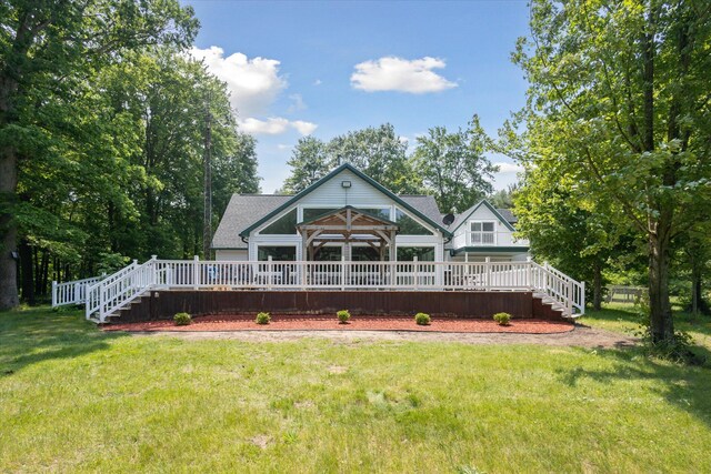 30170 Beeson St, Dowagiac, MI 49047 - rear view of property featuring a yard, stairway, and a wooden deck