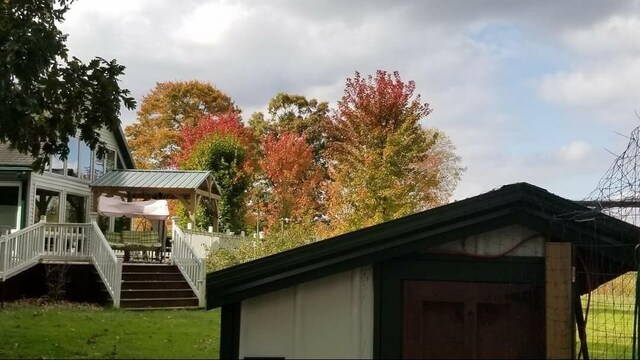 30170 Beeson St, Dowagiac, MI 49047 - view of side of home with stairs and a deck