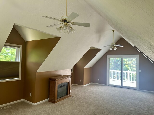 30170 Beeson St, Dowagiac, MI 49047 - bonus room with ceiling fan, vaulted ceiling, carpet flooring, and a glass covered fireplace