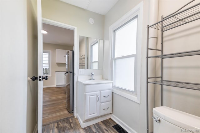 3820 17th St, Grosse Ile, MI 48192 - bathroom featuring wood finished floors and vanity