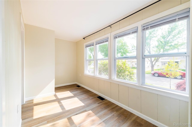 3820 17th St, Grosse Ile, MI 48192 - spare room featuring light wood-style flooring and baseboards