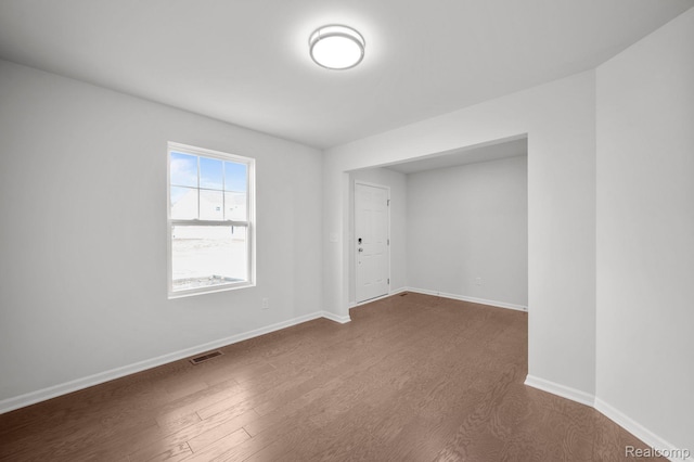 4286 Oak St, Grand Blanc, MI 48439 - empty room featuring baseboards and dark wood-style floors