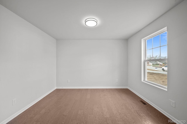 4286 Oak St, Grand Blanc, MI 48439 - empty room with wood finished floors and baseboards