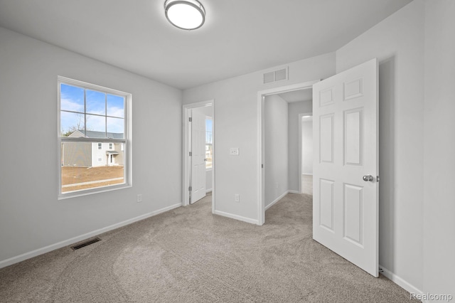 4286 Oak St, Grand Blanc, MI 48439 - unfurnished bedroom featuring carpet flooring and baseboards