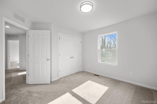 4286 Oak St, Grand Blanc, MI 48439 - unfurnished bedroom featuring carpet and a closet