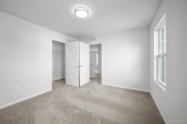 4286 Oak St, Grand Blanc, MI 48439 - unfurnished bedroom featuring carpet flooring, multiple windows, and a closet