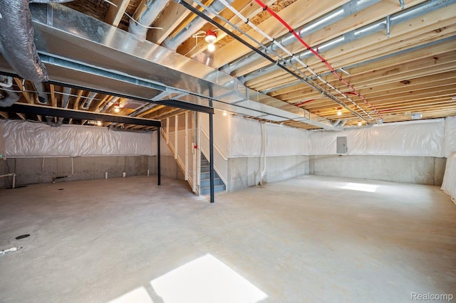4286 Oak St, Grand Blanc, MI 48439 - unfinished below grade area featuring stairs and electric panel