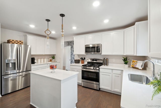 4286 Oak St, Grand Blanc, MI 48439 - kitchen with appliances with stainless steel finishes, light countertops, white cabinets, dark wood-style flooring, and recessed lighting
