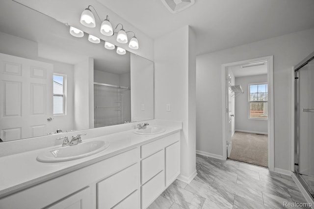 4286 Oak St, Grand Blanc, MI 48439 - full bathroom with double vanity, a shower with door, and marble finish floors