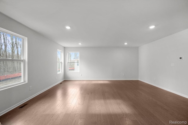 4286 Oak St, Grand Blanc, MI 48439 - empty room featuring plenty of natural light, wood finished floors, and recessed lighting