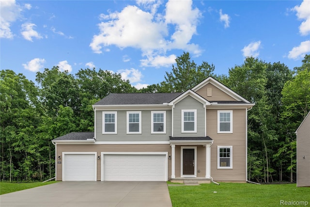 4286 Oak St, Grand Blanc, MI 48439 - view of front of property with concrete driveway, a front yard, and a garage