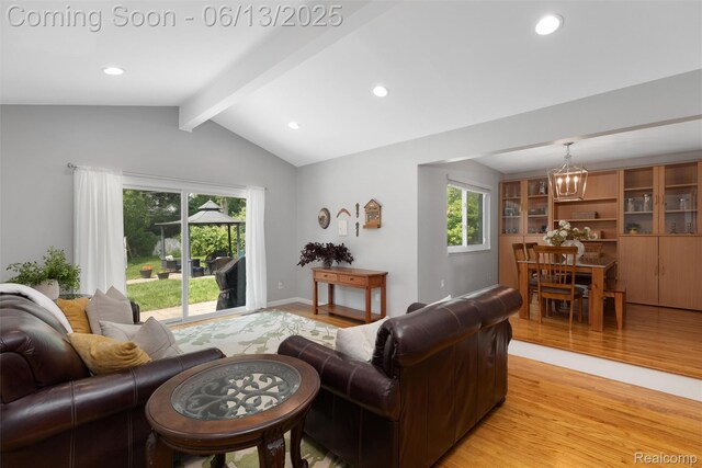 24960 S Cromwell Dr, Franklin, MI 48025 - living area with a chandelier, light wood finished floors, plenty of natural light, and recessed lighting