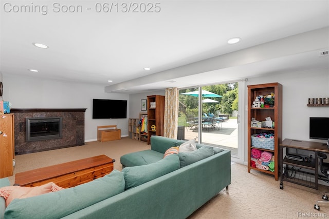 24960 S Cromwell Dr, Franklin, MI 48025 - living room featuring light colored carpet, recessed lighting, and a fireplace