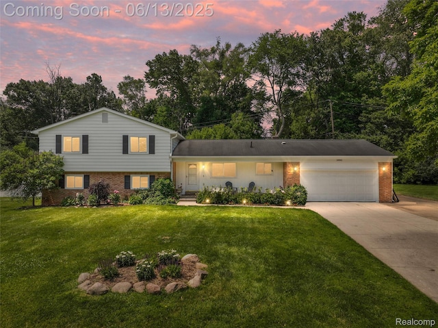 24960 S Cromwell Dr, Franklin, MI 48025 - tri-level home featuring brick siding, concrete driveway, and a front lawn