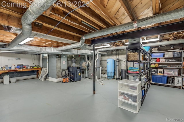 24960 S Cromwell Dr, Franklin, MI 48025 - unfinished basement featuring electric panel, heating unit, a water pressure tank, and a workshop area