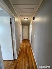 8889 Plainview Ave, Detroit, MI 48228 - hallway featuring wood finished floors and crown molding