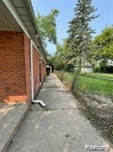 8889 Plainview Ave, Detroit, MI 48228 - view of property exterior featuring brick siding