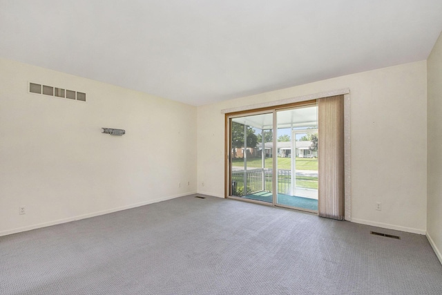 880 Andover Ct SE, Grand Rapids, MI 49508 - empty room featuring carpet flooring and baseboards