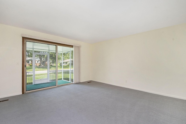 880 Andover Ct SE, Grand Rapids, MI 49508 - empty room with dark colored carpet and baseboards
