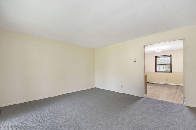 880 Andover Ct SE, Grand Rapids, MI 49508 - empty room featuring carpet and baseboards
