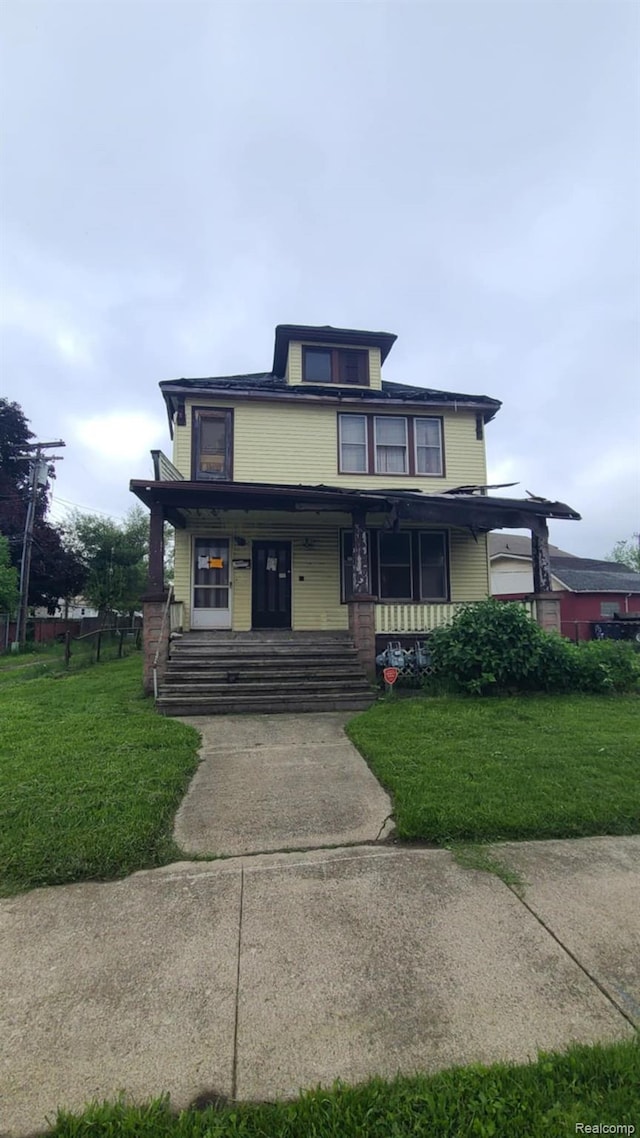 193 Division St, River Rouge, MI 48218 - american foursquare style home with a front yard and a porch
