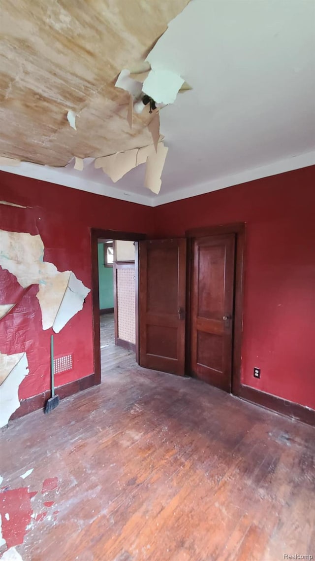 193 Division St, River Rouge, MI 48218 - unfurnished bedroom featuring wood finished floors and baseboards