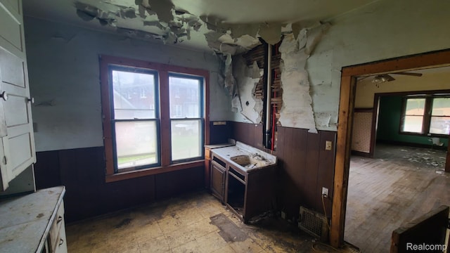 193 Division St, River Rouge, MI 48218 - dining area with a wainscoted wall and wooden walls