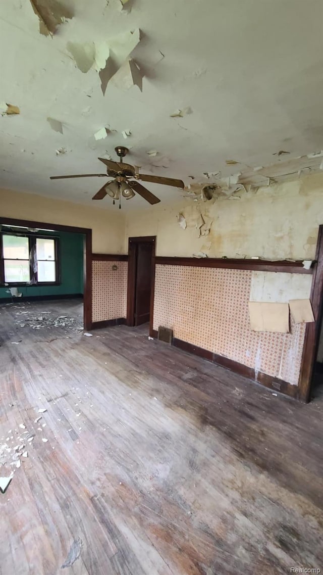 193 Division St, River Rouge, MI 48218 - unfurnished living room with wood finished floors and baseboards