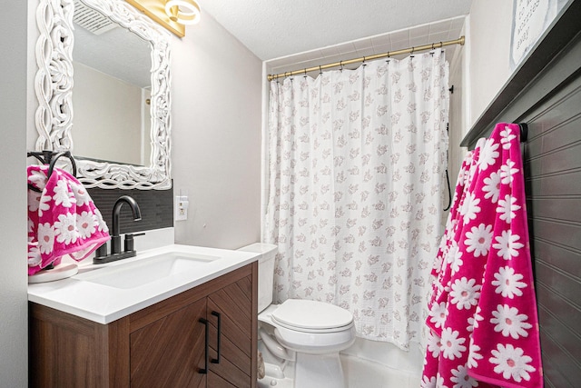 3515 Adams St, Kalamazoo, MI 49008 - bathroom with vanity, a textured ceiling, and a shower with curtain