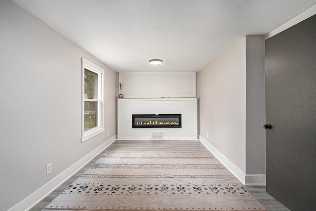 3515 Adams St, Kalamazoo, MI 49008 - detailed view of wood finished floors and a glass covered fireplace