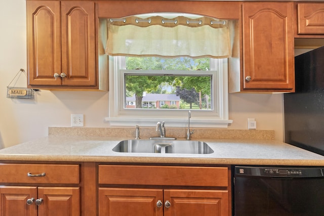 833 S Lansing St, Mason, MI 48854 - kitchen with dishwasher, light countertops, and brown cabinets