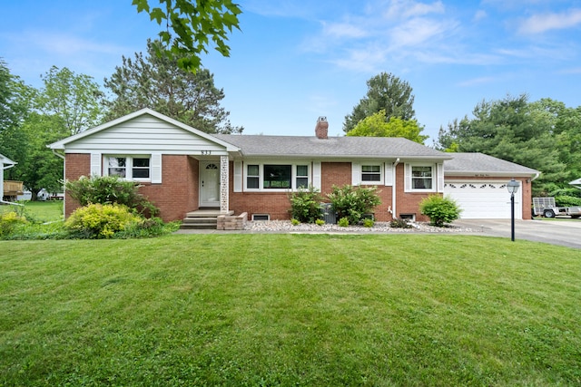 833 S Lansing St, Mason, MI 48854 - ranch-style home featuring brick siding, a chimney, a front yard, and asphalt driveway