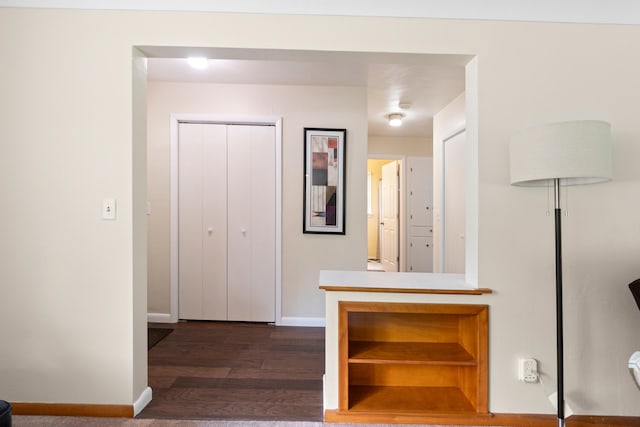 833 S Lansing St, Mason, MI 48854 - hall with baseboards and wood finished floors