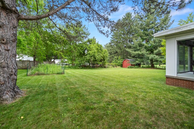 833 S Lansing St, Mason, MI 48854 - view of yard featuring a storage unit