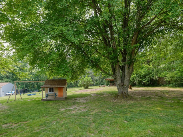 7061 W N Ave, Kalamazoo, MI 49009 - view of yard with a playground and a shed