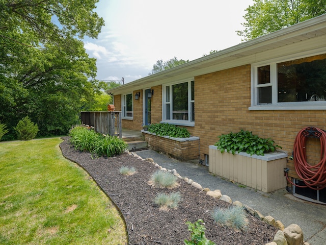 7061 W N Ave, Kalamazoo, MI 49009 - view of front of house with brick siding and a front lawn