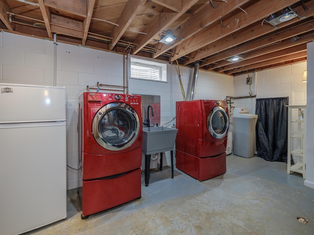 7061 W N Ave, Kalamazoo, MI 49009 - laundry area featuring concrete block wall and independent washer and dryer