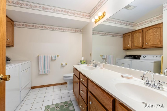 2913 N Wentward Ct, Hudsonville, MI 49426 - full bath with washing machine and dryer, double vanity, and tile patterned floors