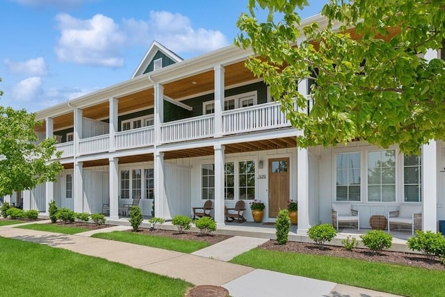 929 Harbor Dr E # 27, Saint Joseph, MI 49085 - view of front of home featuring a balcony, a porch, and board and batten siding