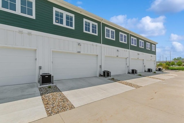 929 Harbor Dr E # 27, Saint Joseph, MI 49085 - back of property with a garage, board and batten siding, and driveway