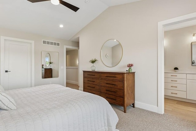 929 Harbor Dr E # 27, Saint Joseph, MI 49085 - bedroom featuring lofted ceiling, light colored carpet, a ceiling fan, and ensuite bathroom