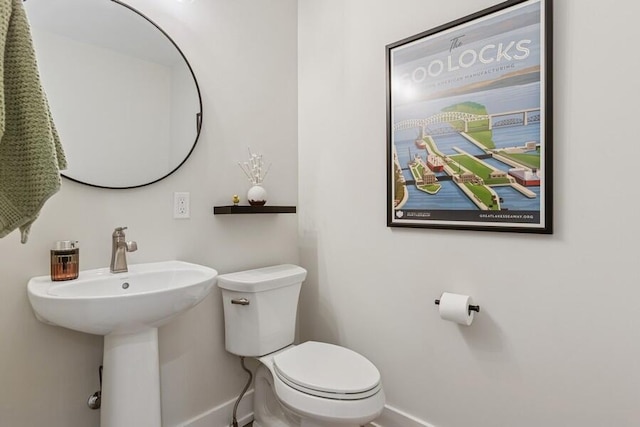 929 Harbor Dr E # 27, Saint Joseph, MI 49085 - half bathroom featuring baseboards and toilet